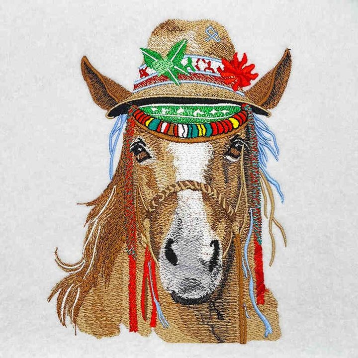 Embroidered design of a horse wearing a colorful hat on a white background