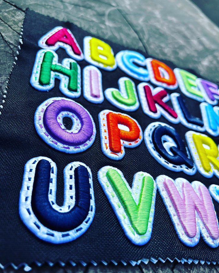 DoubleLayer Pop Custom Appliqué Cap Font – Contrast Colour Layer Detail Shot | Hand Finished in Dubai | EmbroMania
