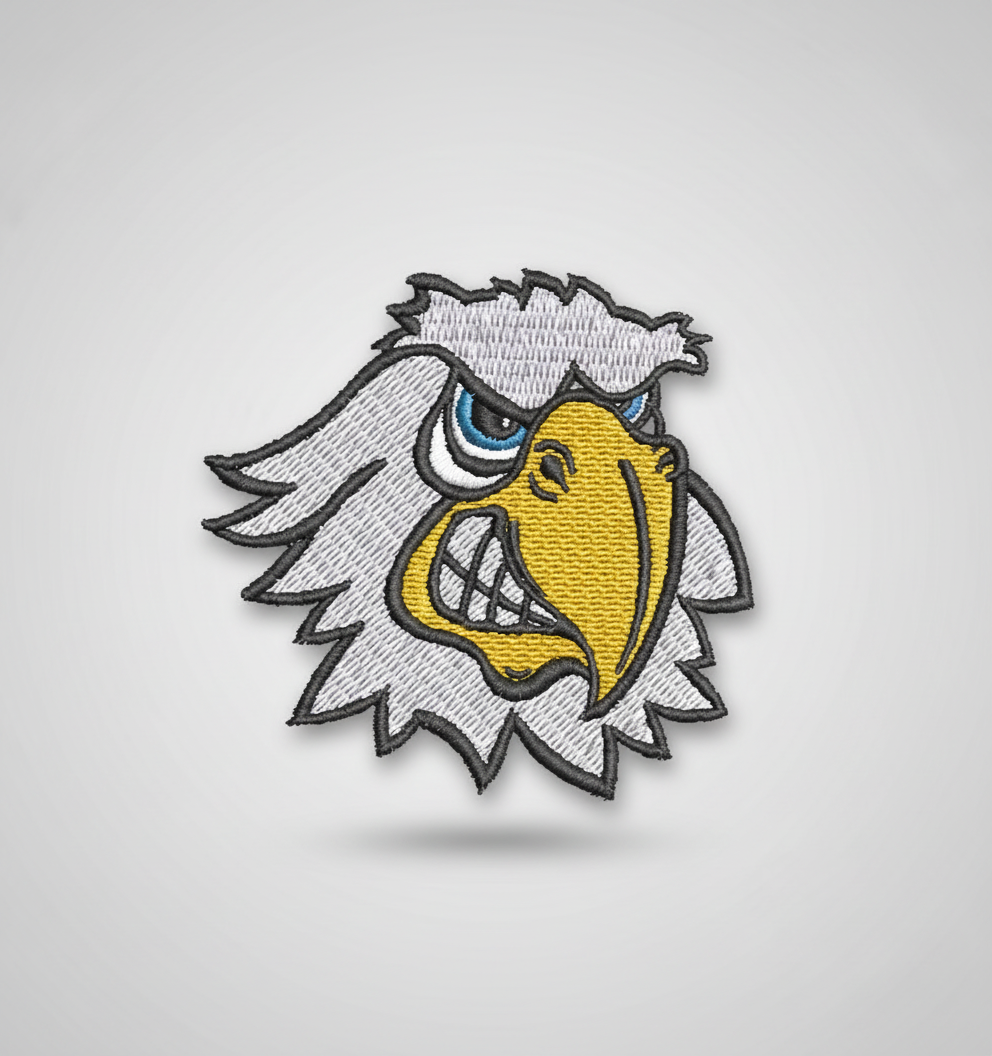 Hawk embroidery patch featuring a fierce white bird head mascot with a large yellow beak, blue eye, and bold black outline stitching, on a light background, original EmbroMania artwork.