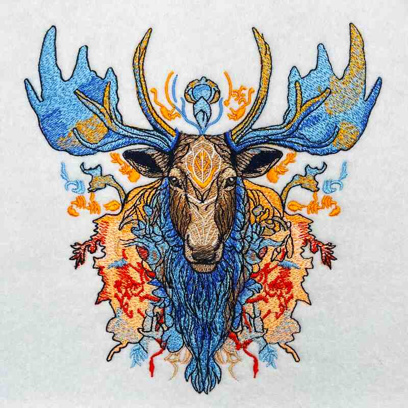 Embroidered design of a deer with large antlers on a white background