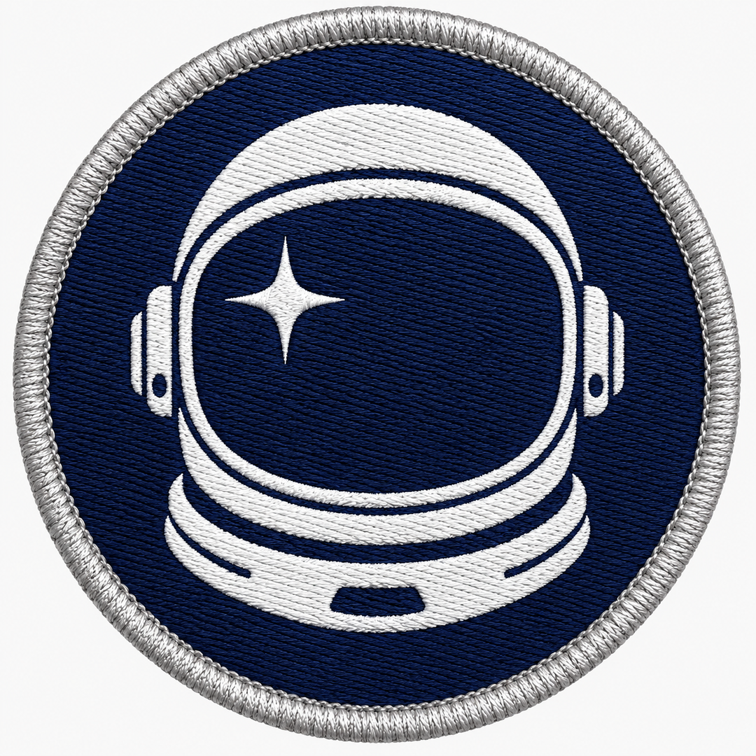 Astronaut Drift embroidery patch featuring an astronaut helmet silhouette with a star reflection in flat navy and white | Hand Finished in Dubai | EmbroMania