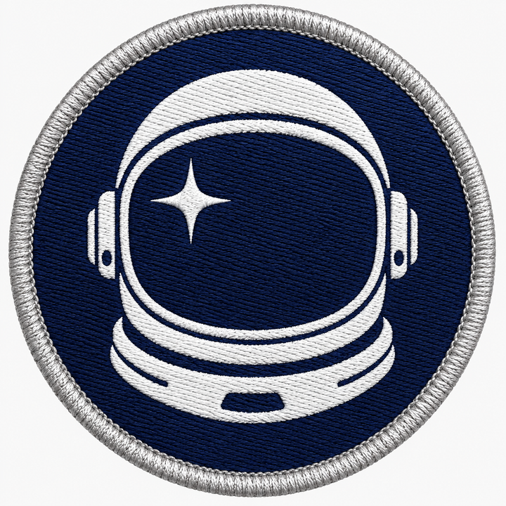 Astronaut Drift embroidery patch featuring an astronaut helmet silhouette with a star reflection in flat navy and white | Hand Finished in Dubai | EmbroMania