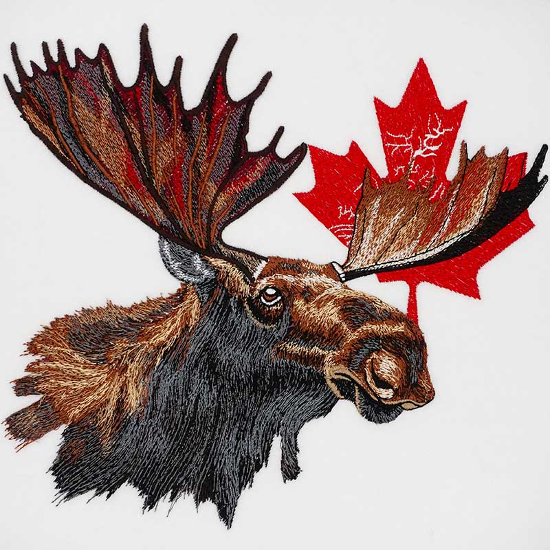 Canadian Moose Crest Machine Embroidered Hoodie – Close-up detail of bull moose and maple leaf embroidery with fine antler and fur texture | Hand Finished in Dubai
