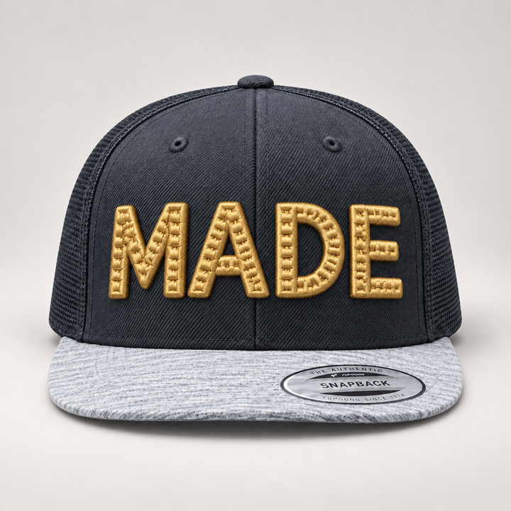 🏅 Artisan Gold – CenterCross Stitch 3D Puff · Gold thread · Charcoal &amp; Heather Grey Snapback | Hand Finished in Dubai | EmbroMania