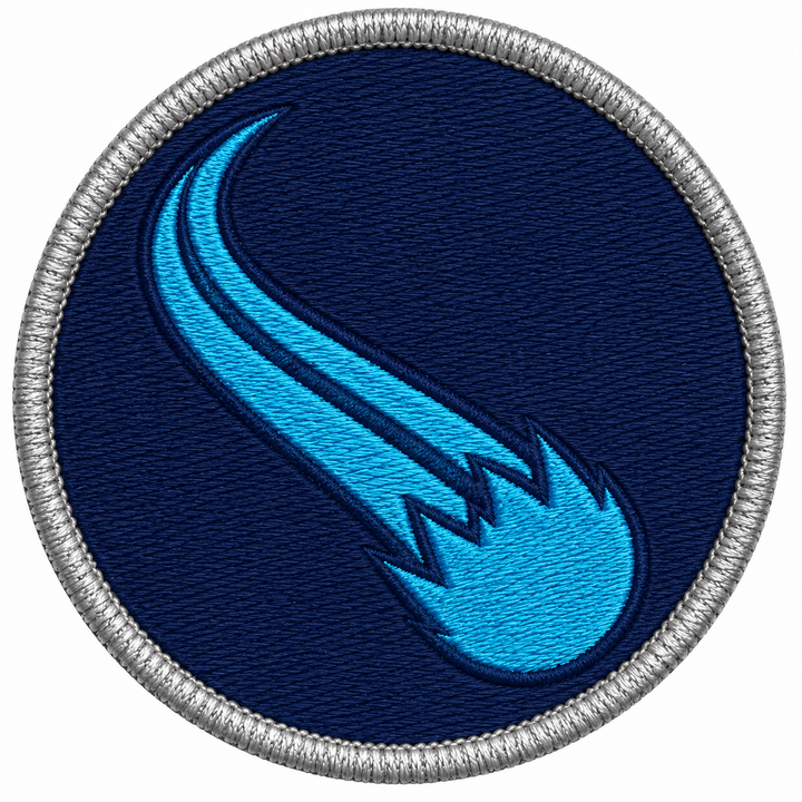 Comet Trail embroidery patch featuring a comet with a long curved tail in flat navy and cyan | Hand Finished in Dubai | EmbroMania