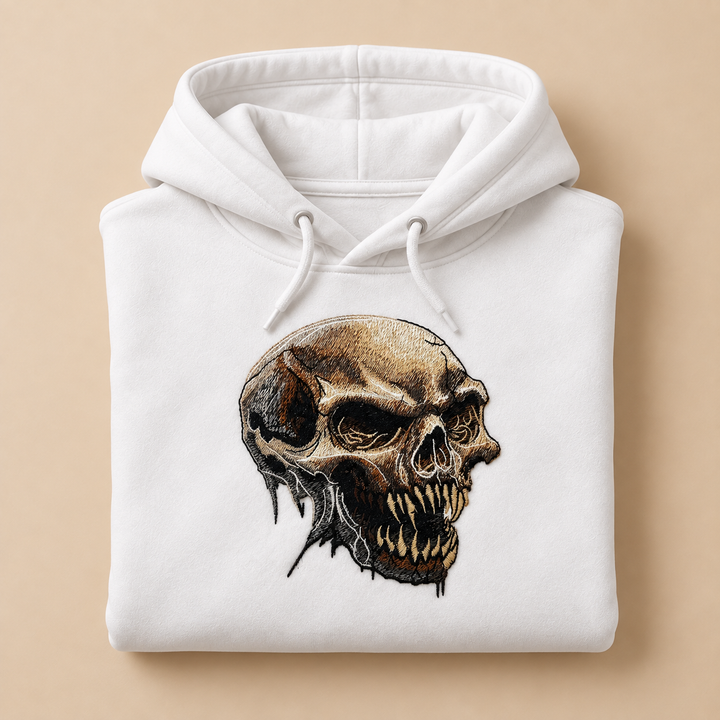 Feral Bonefang Skull Machine Embroidered Hoodie in Medium Black – Bone-toned fanged skull design embroidered on black 320gsm premium fleece | Hand Finished in Dubai