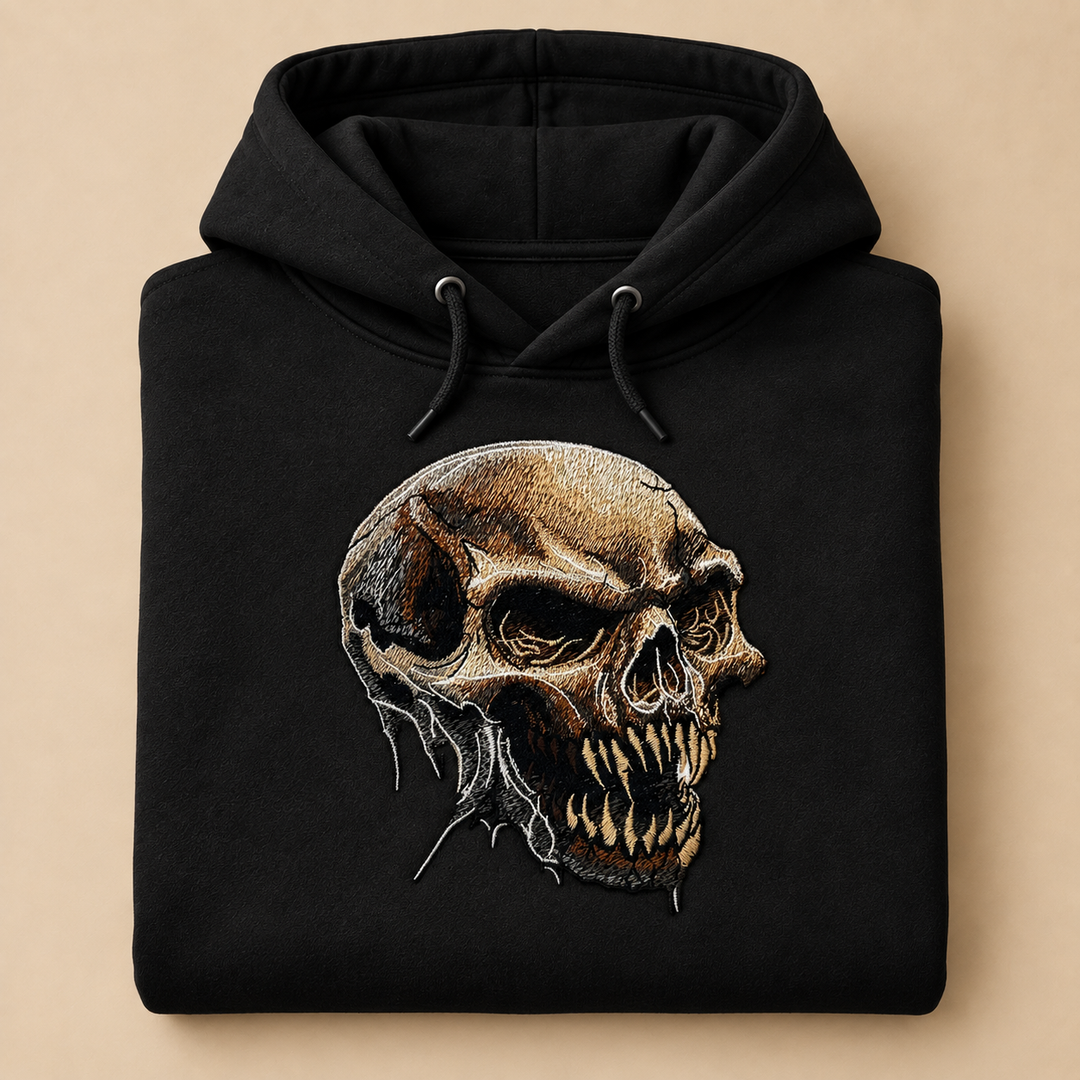 Feral Bonefang Skull Machine Embroidered Hoodie in Medium White – Bone-toned fanged skull design embroidered on white 320gsm premium fleece | Hand Finished in Dubai