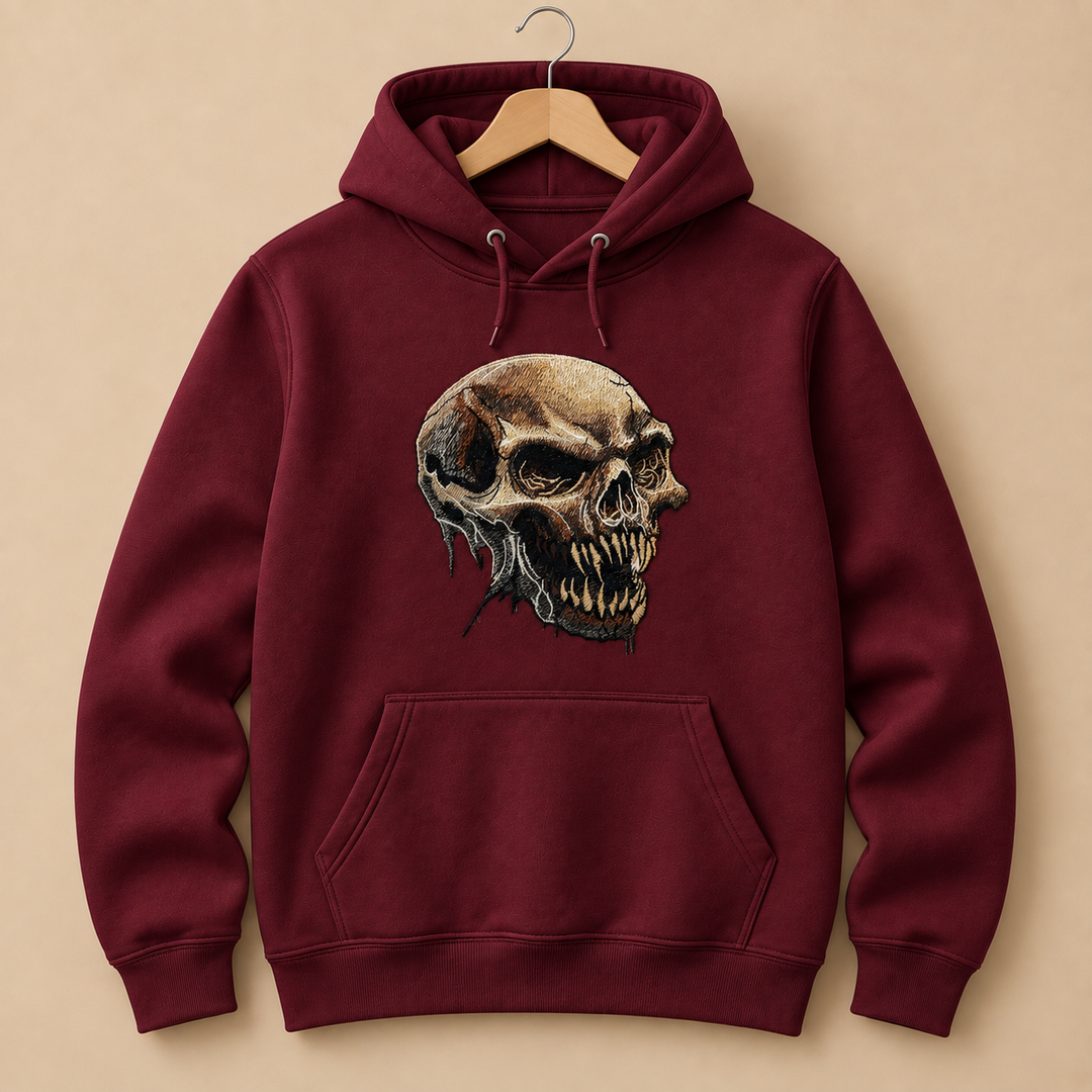 Feral Bonefang Skull Machine Embroidered Hoodie in Small Burgundy – Bone-toned fanged skull design embroidered on burgundy 320gsm premium fleece | Hand Finished in Dubai