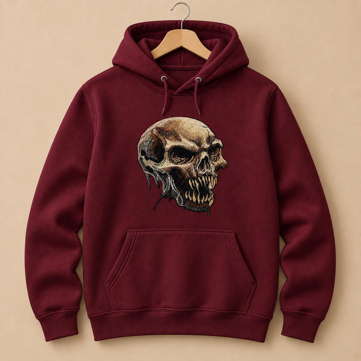 Feral Bonefang Skull Machine Embroidered Hoodie in Small Burgundy – Bone-toned fanged skull design embroidered on burgundy 320gsm premium fleece | Hand Finished in Dubai