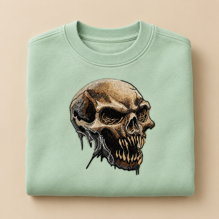 Feral Bonefang Skull Machine Embroidered Sweatshirt in Large Khaki – Bone-toned fanged skull design embroidered on khaki 320gsm cotton fleece crewneck | Hand Finished in Dubai
