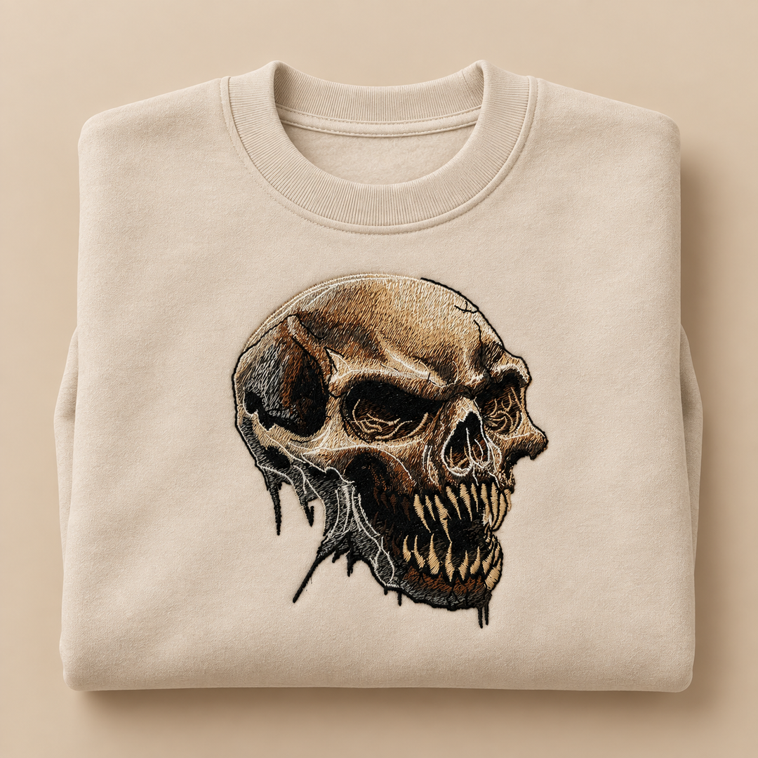Feral Bonefang Skull Machine Embroidered Sweatshirt in Large White – Bone-toned fanged skull design embroidered on white 320gsm cotton fleece crewneck | Hand Finished in Dubai