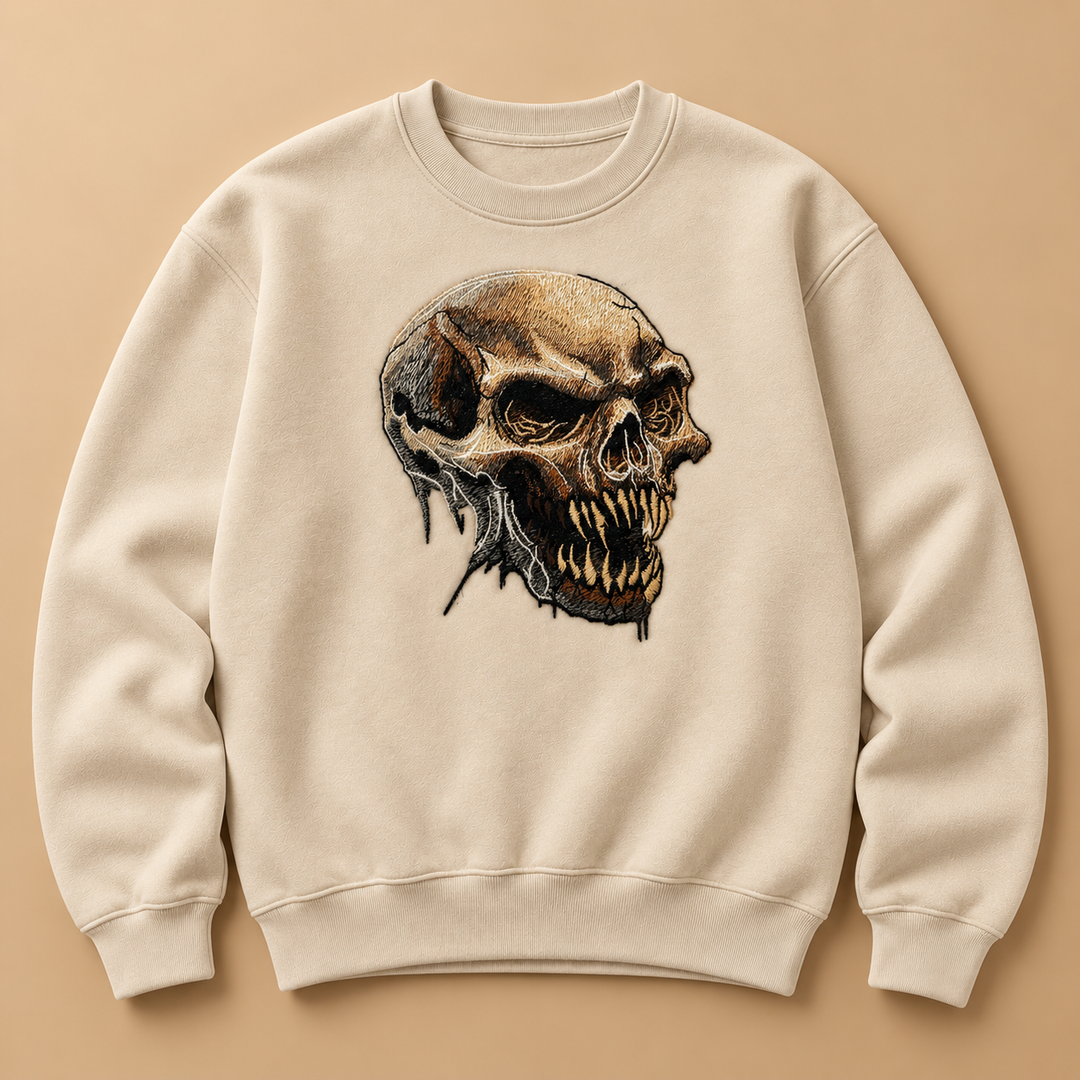 Feral Bonefang Skull Machine Embroidered Sweatshirt in Small White – Bone-toned fanged skull design embroidered on white 320gsm cotton fleece crewneck | Hand Finished in Dubai