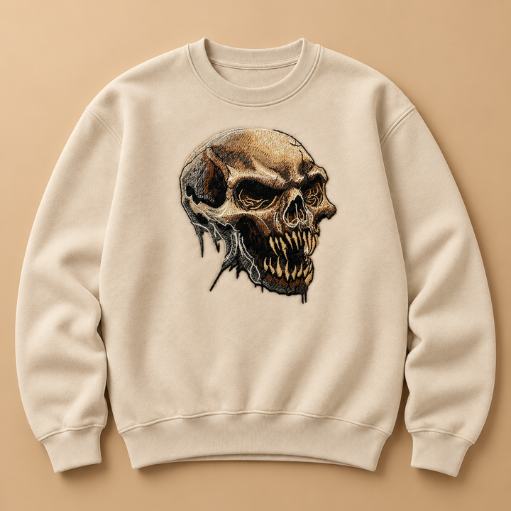 Feral Bonefang Skull Machine Embroidered Sweatshirt in Small White – Bone-toned fanged skull design embroidered on white 320gsm cotton fleece crewneck | Hand Finished in Dubai
