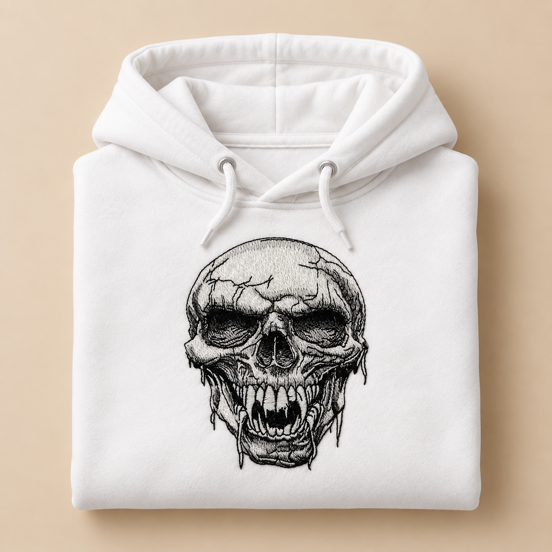 Hollow Fang Skull Machine Embroidered Hoodie in Medium Black – Monochrome fanged skull design embroidered on black 320gsm premium fleece | Hand Finished in Dubai