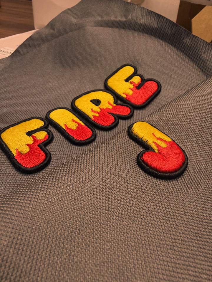 🔥🟡 Inferno – Inferno Pop Custom Cap Font · Yellow fill · Red flame · Black outline · FIRE embroidered close-up | Hand Finished in Dubai | EmbroMania