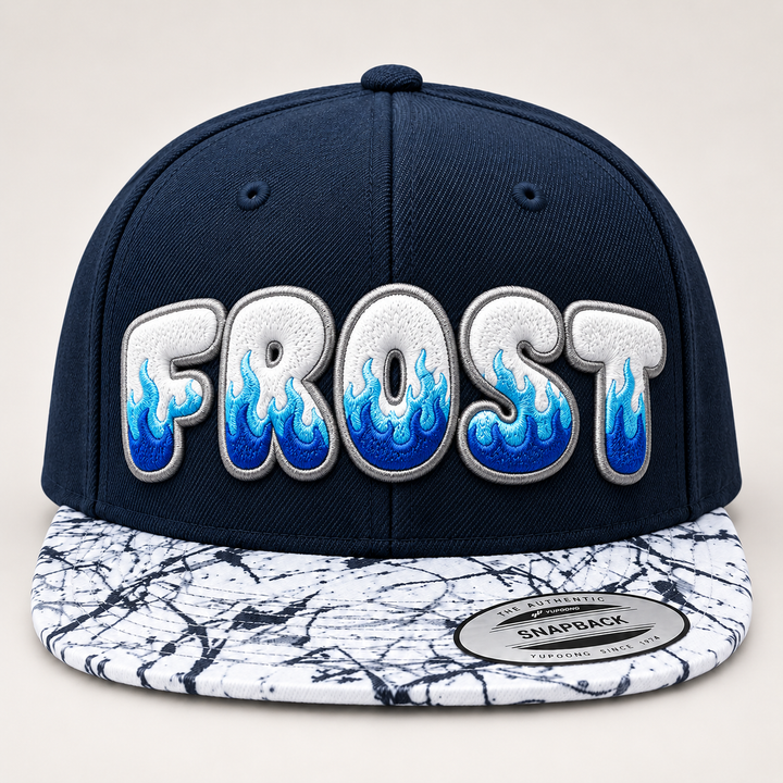 🔥🧊 Frostfire – Inferno Pop Custom Cap Font · White fill · Ice-blue flame · Silver outline · Navy Crown &amp; Marble Brim | Hand Finished in Dubai | EmbroMania