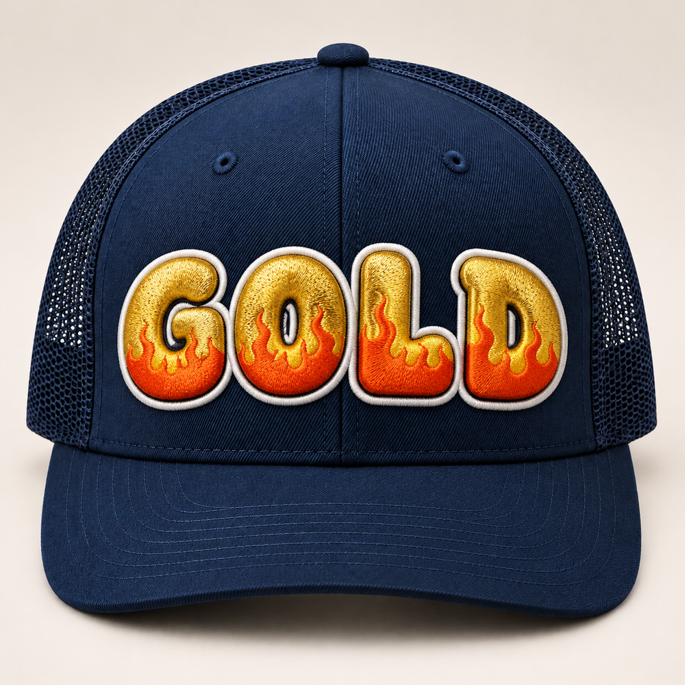 🔥👑 Gilded Flame – Inferno Pop Custom Cap Font · Gold fill · Orange flame · White outline · Dark Navy Curved Trucker | Hand Finished in Dubai | EmbroMania