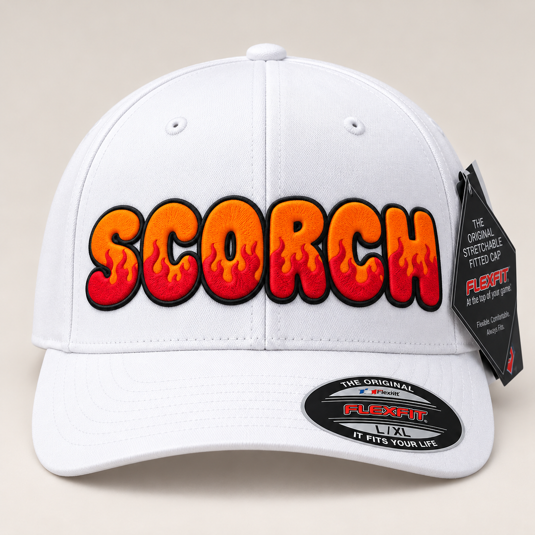 🔥🧡 Sunset Scorch – Inferno Pop Custom Cap Font · Orange fill · Crimson flame · Black outline · White Solid Flexfit | Hand Finished in Dubai | EmbroMania