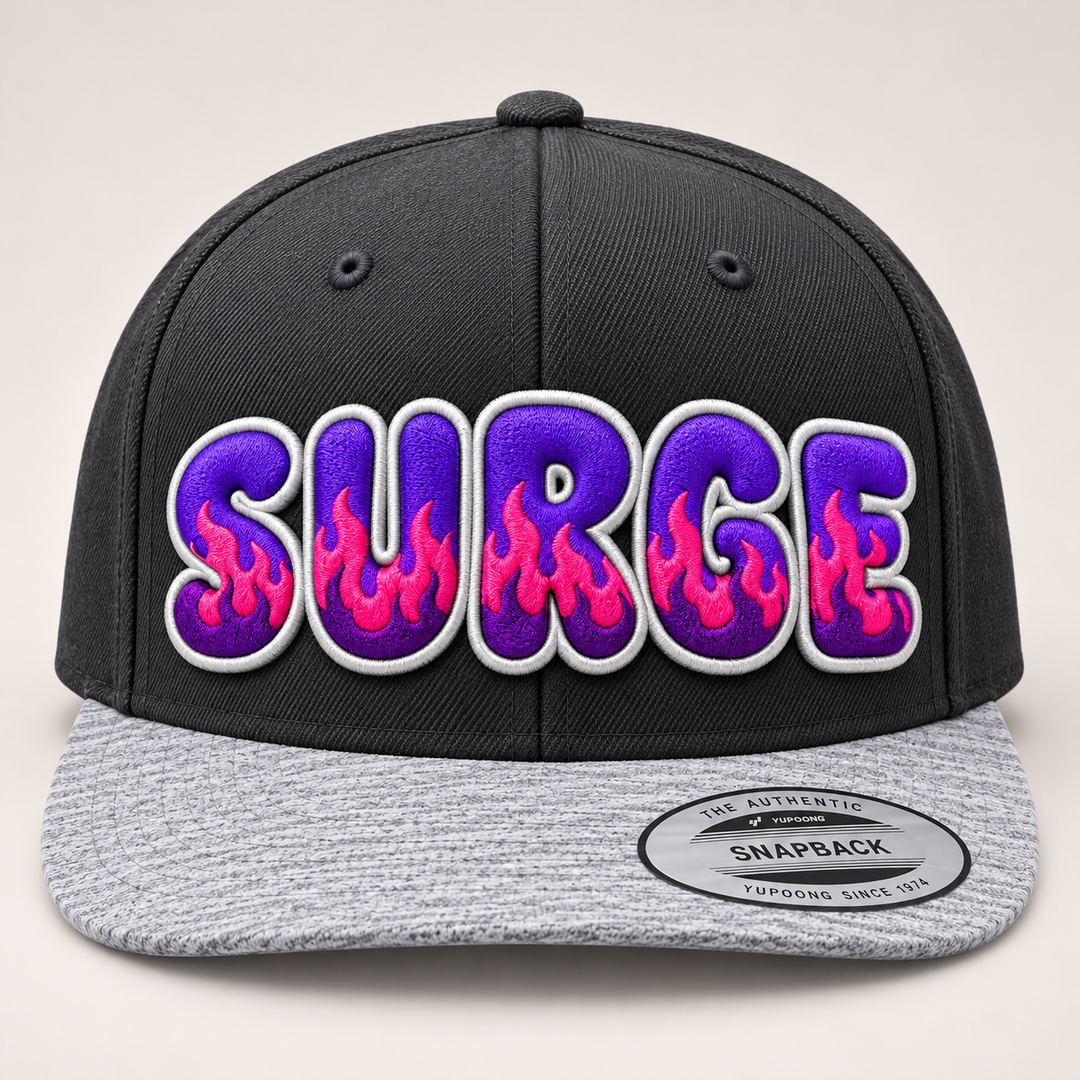 🔥🟣 Violet Surge – Inferno Pop Custom Cap Font · Electric purple fill · Hot pink flame · White outline · Charcoal &amp; Heather Grey Snapback | Hand Finished in Dubai | EmbroMania