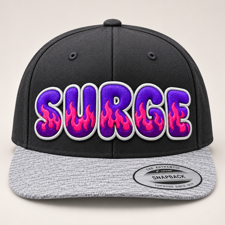 🔥🟣 Violet Surge – Inferno Pop Custom Cap Font · Electric purple fill · Hot pink flame · White outline · Charcoal &amp; Heather Grey Snapback | Hand Finished in Dubai | EmbroMania