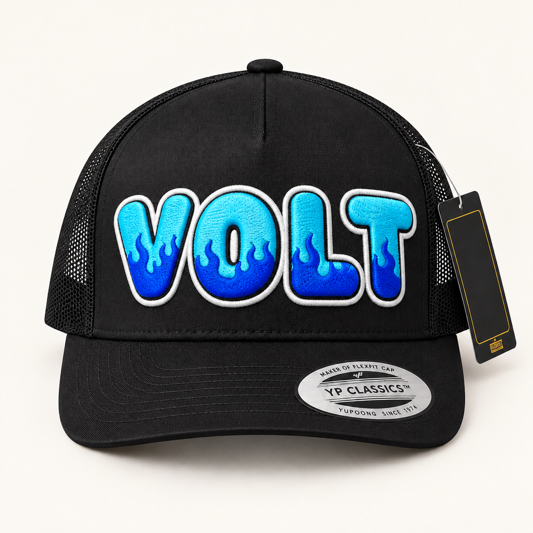 🔥⚡ Voltfire – Inferno Pop Custom Cap Font · Cyan fill · Electric blue flame · White outline · Black Curved Trucker | Hand Finished in Dubai | EmbroMania
