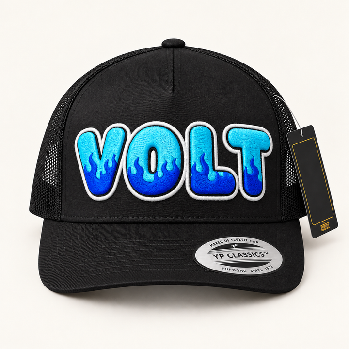 🔥⚡ Voltfire – Inferno Pop Custom Cap Font · Cyan fill · Electric blue flame · White outline · Black Curved Trucker | Hand Finished in Dubai | EmbroMania