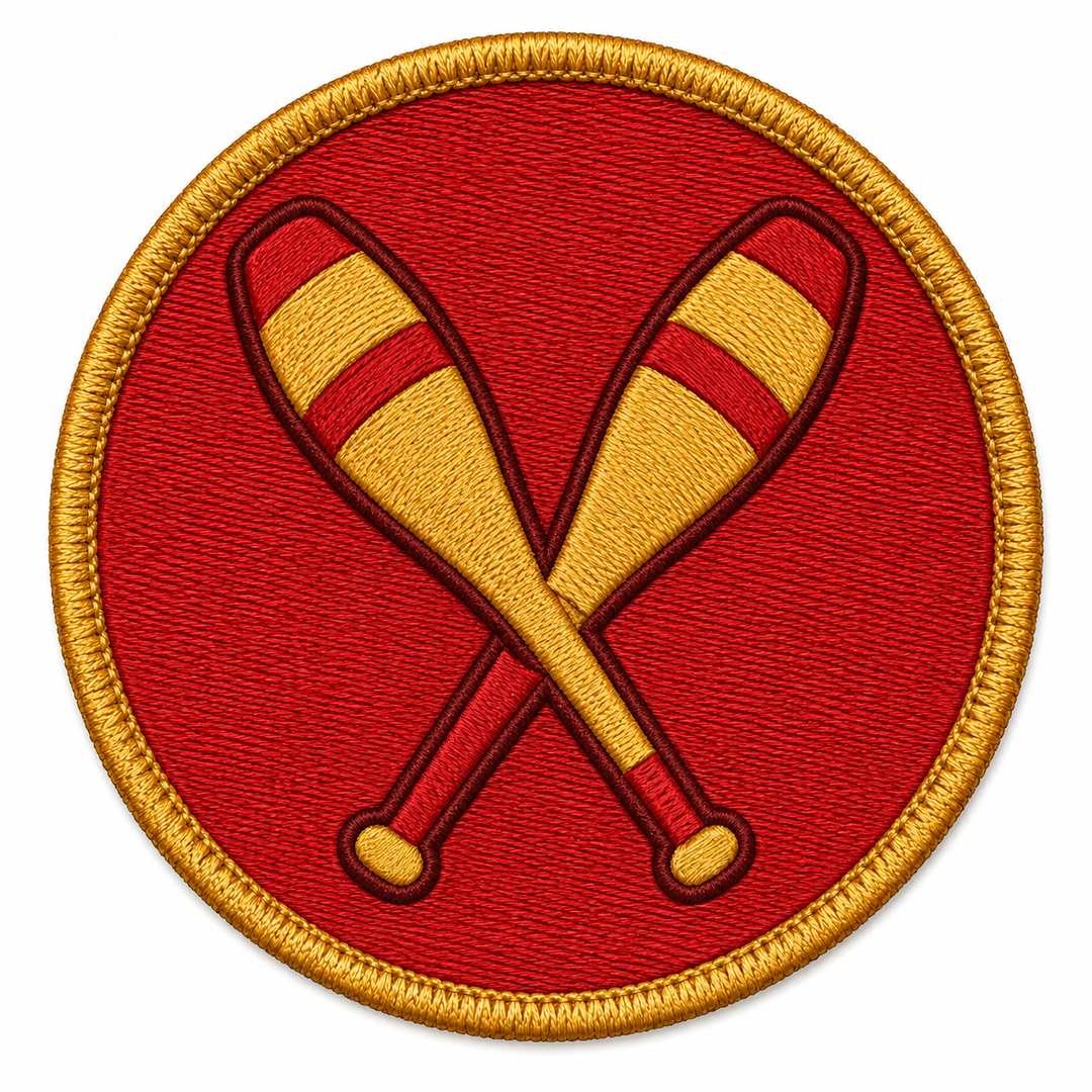 Juggling Pins Cross embroidery patch featuring two crossed juggling batons in red and gold on a red circular patch | Hand Finished in Dubai | EmbroMania