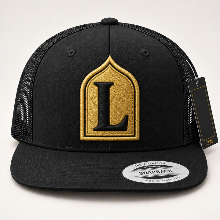 ⚡ Gold Gate – Monogram Crest · Gold crest · Black letter · Black Flat Trucker | Hand Finished in Dubai | EmbroMania