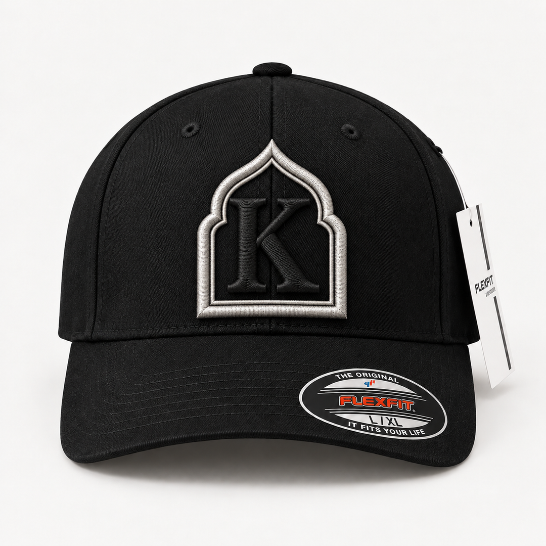🖤 Noir Arch – Monogram Crest · Silver crest · Black letter · Black Flexfit | Hand Finished in Dubai | EmbroMania