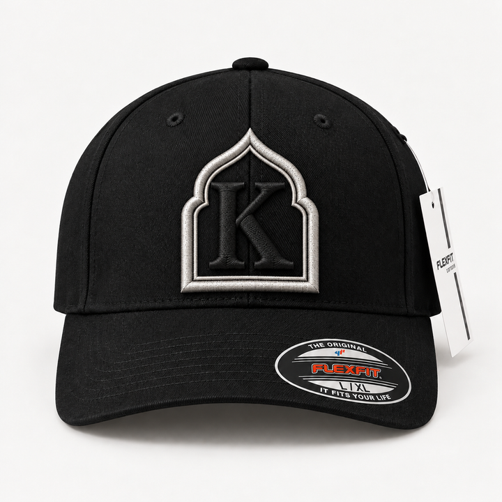 🖤 Noir Arch – Monogram Crest · Silver crest · Black letter · Black Flexfit | Hand Finished in Dubai | EmbroMania