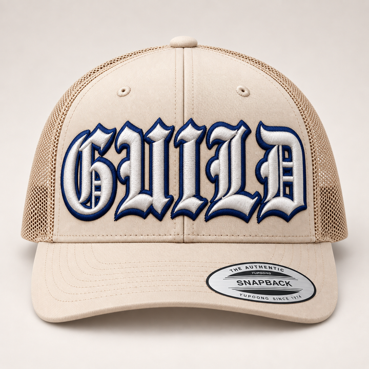 🌊 Collegiate Navy – Old English 3D Puff · White fill · Navy outline · Sand Beige Retro Trucker | Hand Finished in Dubai | EmbroMania