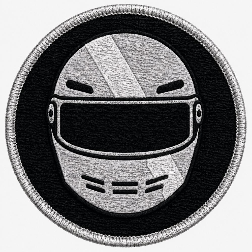 Racing Helmet Crest embroidery patch featuring a front-facing racing helmet with a diagonal stripe in flat black and silver | Hand Finished in Dubai | EmbroMania