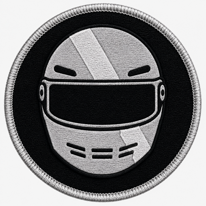 Racing Helmet Crest embroidery patch featuring a front-facing racing helmet with a diagonal stripe in flat black and silver | Hand Finished in Dubai | EmbroMania