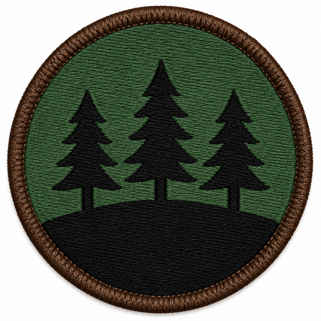 Ridgeline Pines embroidery patch featuring three pine trees along a ridge line in flat forest green and black | Hand Finished in Dubai | EmbroMania
