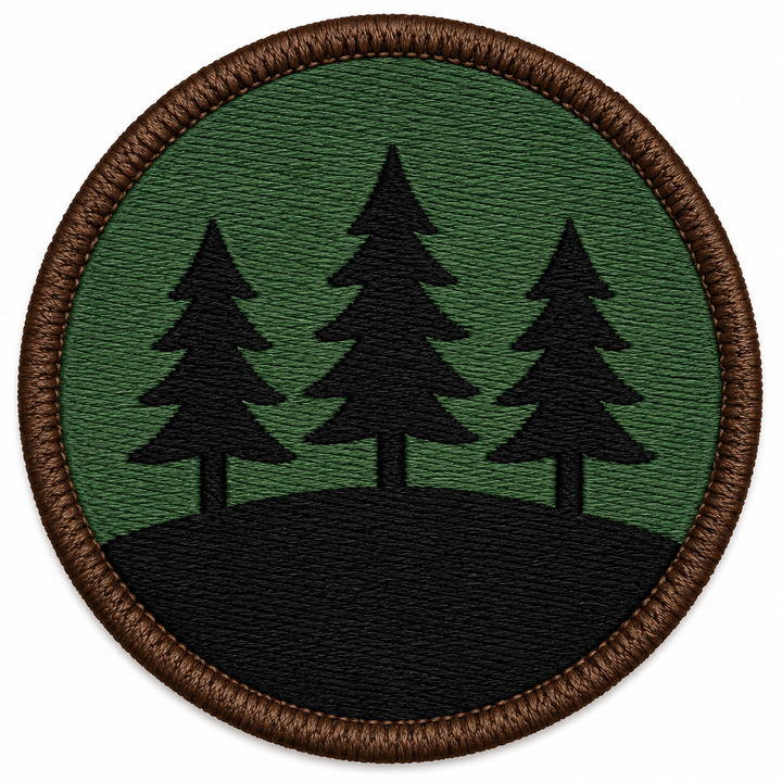 Ridgeline Pines embroidery patch featuring three pine trees along a ridge line in flat forest green and black | Hand Finished in Dubai | EmbroMania