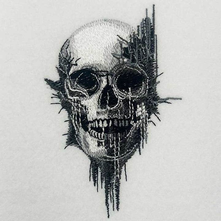 Static Fracture Skull Machine Embroidered Sweatshirt – Close-up detail of glitch-effect fractured skull embroidery with fine crack and stitch texture | Hand Finished in Dubai