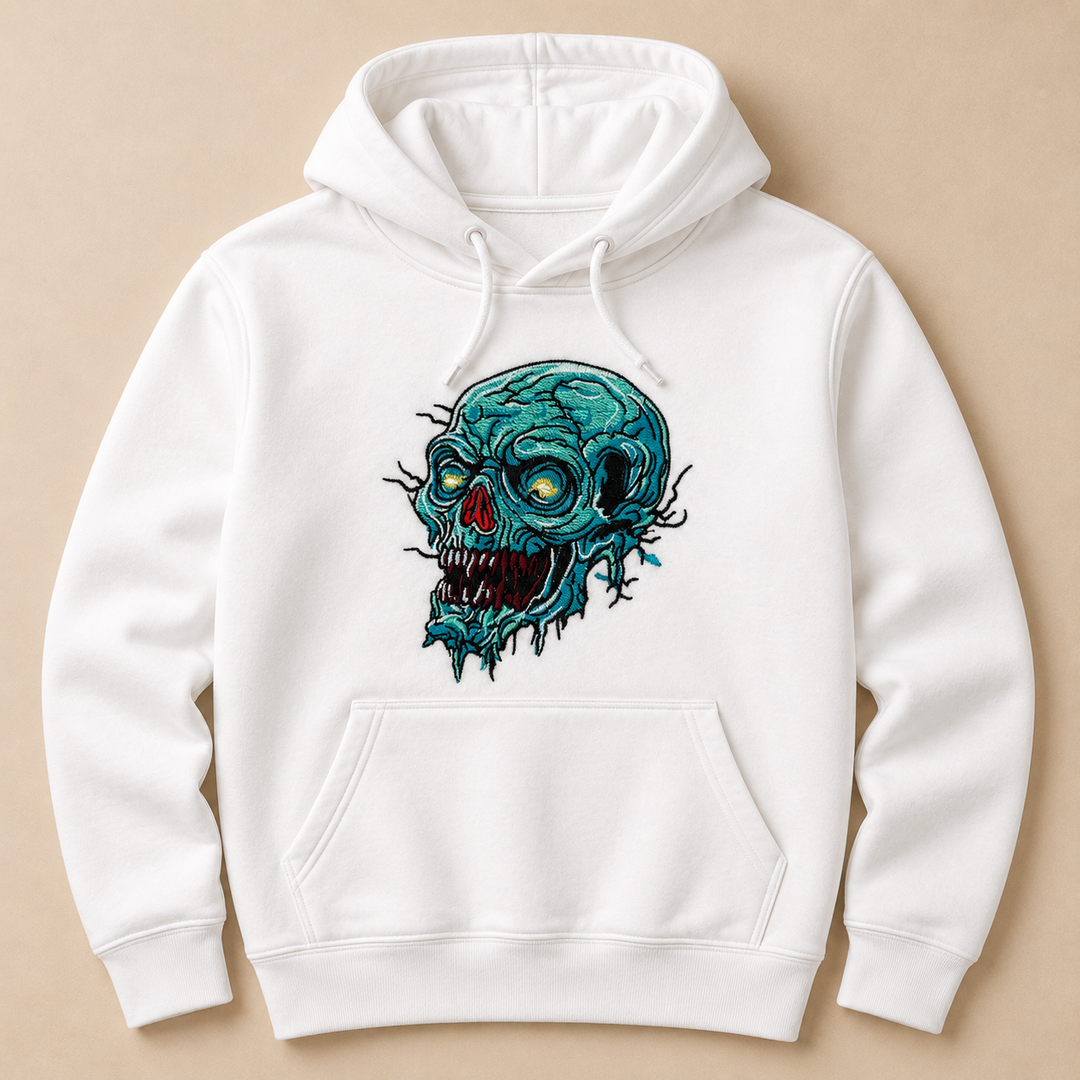 Swamp Wraith Skull Machine Embroidered Hoodie in Medium Black – Rotting teal skull design with dripping tendrils embroidered on black 320gsm premium fleece | Hand Finished in Dubai