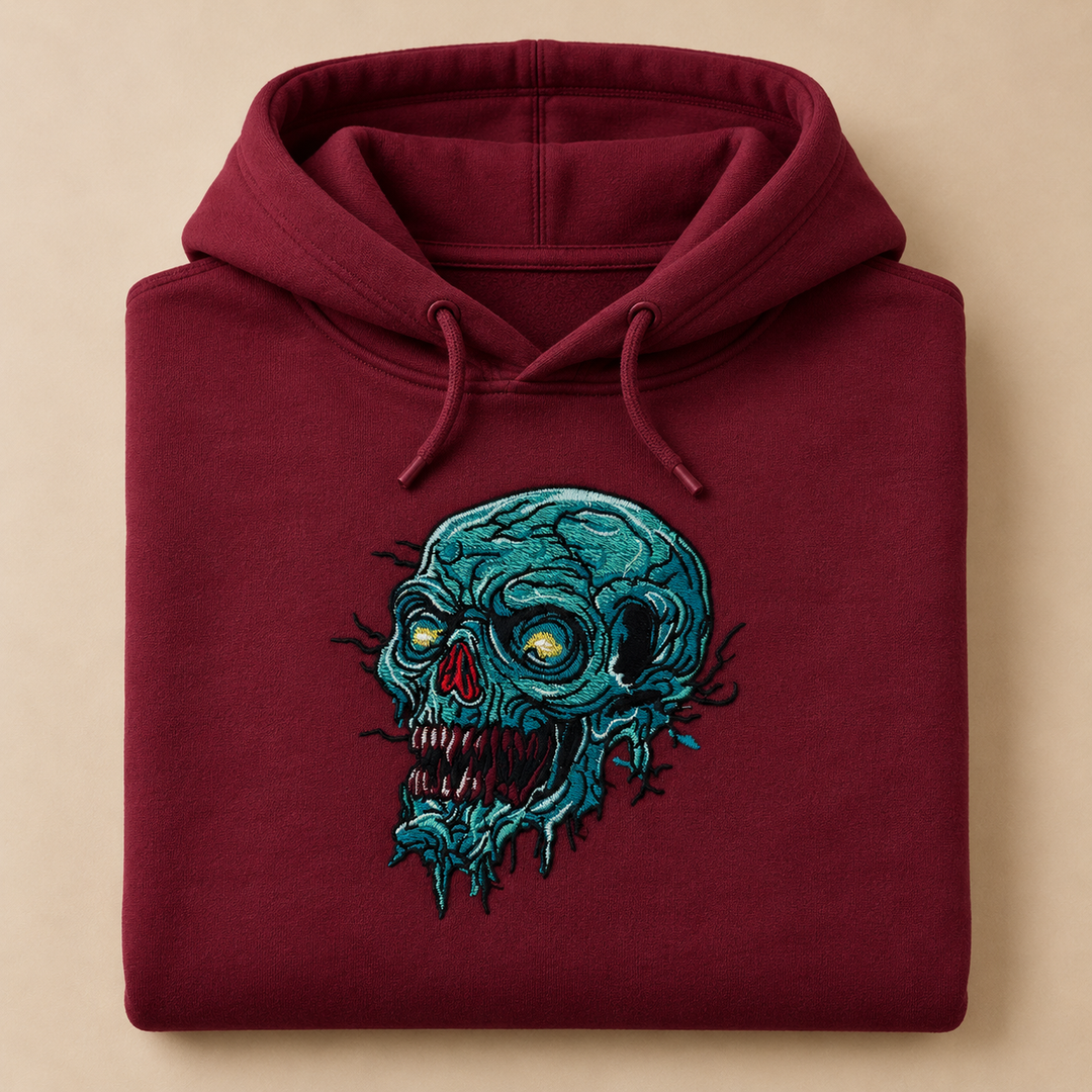 Swamp Wraith Skull Machine Embroidered Hoodie in Medium Burgundy – Rotting teal skull design with dripping tendrils embroidered on burgundy 320gsm premium fleece | Hand Finished in Dubai
