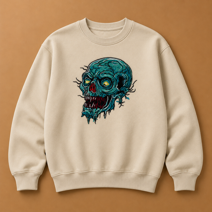 Swamp Wraith Skull Machine Embroidered Sweatshirt in Small White – Rotting teal skull design embroidered on white 320gsm cotton fleece crewneck | Hand Finished in Dubai