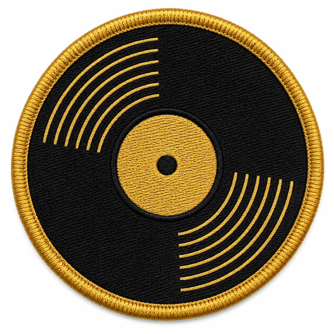 Vinyl Spin embroidery patch featuring a vinyl record with groove lines and a center label in flat black and gold | Hand Finished in Dubai | EmbroMania